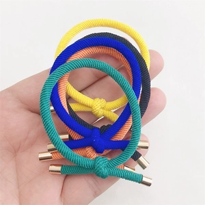 Set of 5 elastic braided hair ties in various colors with golden metal caps