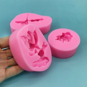 Pink silicone cake molds in flower shapes for baking chocolate and fondant decorations