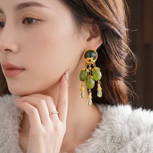Vintage long tassel earrings with olive green stones and engraved matte gold finish