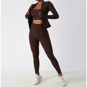 Three-piece chocolate brown yoga set featuring high waist leggings and zip jacket with thumbholes