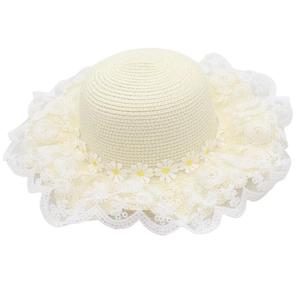 Close-up of baby straw hat with delicate white lace trim and small daisy floral details