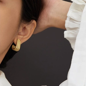 Chic triple-row golden geometric stud earrings made of high-quality polished titanium steel