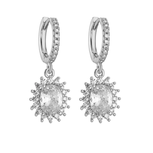 Close-up of halo zircon earrings featuring oval cut stones and micro-paved silver hoops