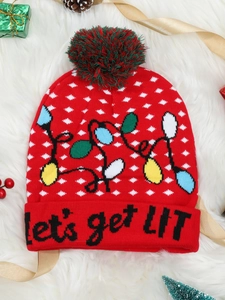 Detail of red Christmas knit hat with festive bulb pattern and 'let's get LIT' slogan