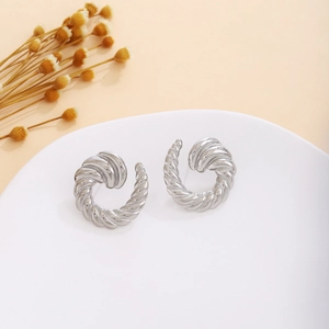 Elegant silver twisted spiral stud earrings with a textured metallic finish for women