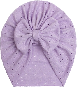 Detail of light purple baby turban hat with eyelet embroidery and a large bow