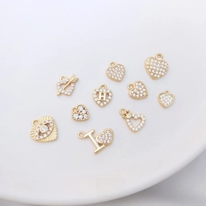Detailed macro view of 14K gold plated heart pendants with micro-pave cubic zirconia