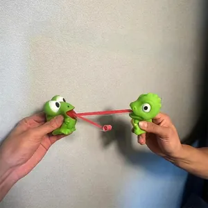Squeaky green frog stress relief toy with retractable red tongue for kids