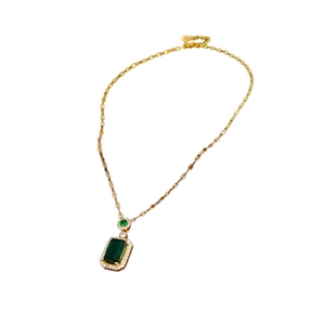 French vintage emerald square necklace with gold chain and sparkling diamond halo