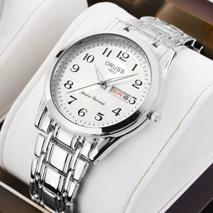 Close-up of ORUSS luminous quartz watch featuring day-date display on white dial