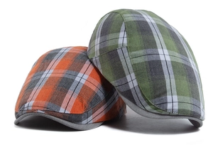 Close-up of lightweight plaid beret hats showing breathable fabric and diagonal twill texture