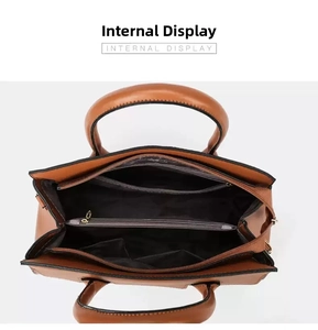 Internal view of brown large capacity tote bag with compartments and pebble leather texture