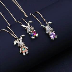 Detailed close-up of rabbit pendants with colorful micro-inlaid zircons and gold plating