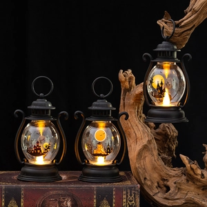 Retro Halloween LED lanterns with pumpkin and bat silhouettes on vintage books