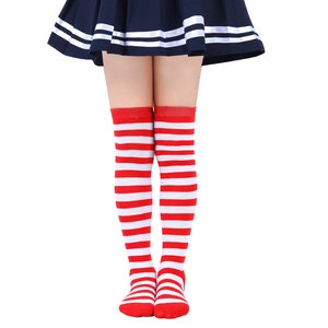 Close-up of red and white striped knee-high knitted socks for kids in a school style