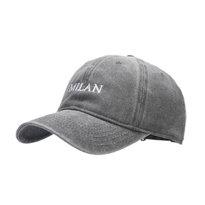 Dark grey washed cotton baseball cap with white MILAN embroidery from 45-degree angle