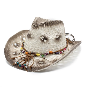 Retro hollow woven straw cowboy hat with ethnic beaded band and vintage distressed finish