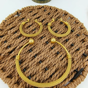 Golden mesh texture jewelry set including hoop earrings and open cuff bracelet