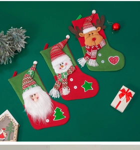 Detail of knitted Christmas stockings featuring 3D Santa, Snowman and Reindeer characters