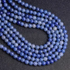 Detailed view of natural blue lapis lazuli round beads with white stone textures