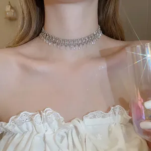Sparkling silver choker necklace with rhinestones and teardrop zircon pendants