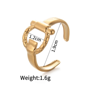 Close-up of 14K gold open ring with horsebit detail showing 1.2cm and 1.9cm measurements