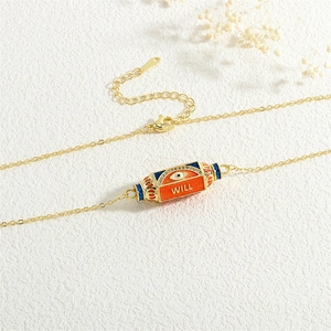 Golden hexagon pendant necklace with evil eye and WILL text on white background