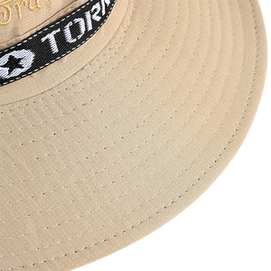Close-up of beige sun hat showing fine embroidery and reinforced brim stitching details