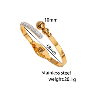 Golden titanium steel open bangle featuring rhinestones and triple bead design