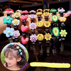 Detail of colorful cartoon hairbands with floral and heart patterns for children