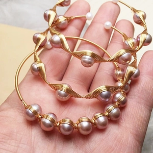 Handmade 14K gold wire wrapped freshwater pearl bracelet with elegant spiral design