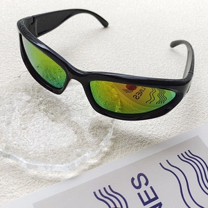 Detail of kids rectangle sunglasses with green yellow gradient lenses and black frames