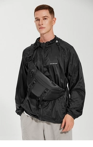 Close-up of black tactical chest bag showing plastic buckles and nylon fabric texture