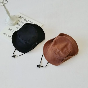 Outdoor sun hats in black and brown featuring adjustable chin straps and side metal buttons