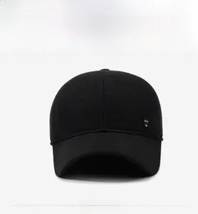 Detail of black knit texture baseball cap with SPORT side logo and woven patch