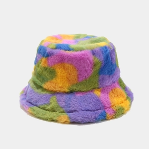 Close-up of colorful tie-dye faux fur bucket hat with soft plush texture for winter