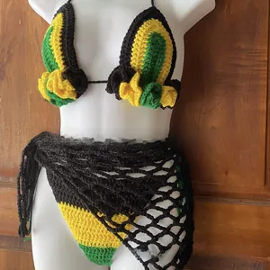 Detail of handmade crochet bikini set featuring yellow, green, and black mesh patterns