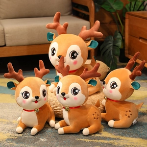 Cute brown sika deer plush toys with red ribbon bells in a cozy home setting
