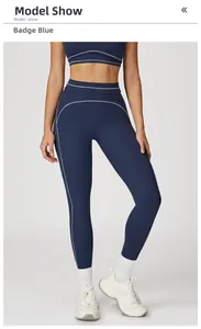 Detail of high-waisted yoga leggings with white contrast stitching and sporty seam lines