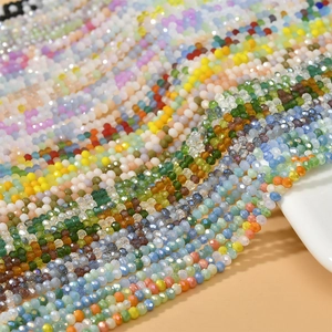 Macro detail of 3mm multifaceted crystal beads in various vibrant colors for jewelry making