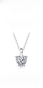Macro shot of a heart-shaped Moissanite necklace in 925 sterling silver with 4-prong setting