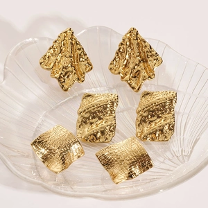 Golden irregular geometric stainless steel earrings set with textured square designs