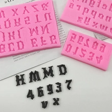 Macro shot of pink silicone molds for gothic letters and numbers in resin craft and baking