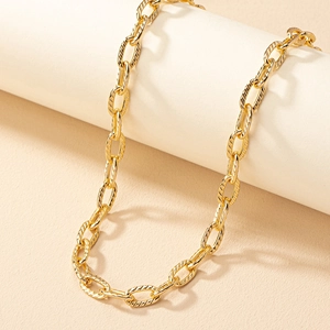 Unisex gold hip-hop punk style textured oval link chain necklace displayed on a stand
