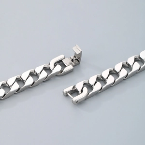 Polished silver stainless steel Cuban link bracelet with a secure fold-over clasp closure