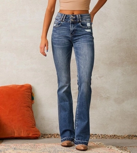 Close-up of blue washed flared jeans with high waist double buttons and distressed details