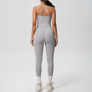 Back view of light grey yoga set featuring criss-cross sports bra and high-waisted leggings