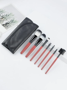 Detail of 8pcs redwood handle makeup brushes with synthetic bristles and black leather pouch