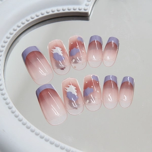 Press-on nails featuring purple gradient French tips and hand-painted cloud designs