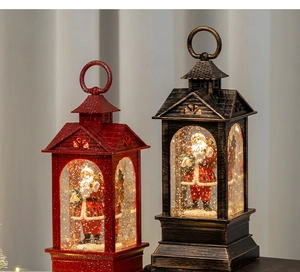 Detail of Christmas lantern with Santa figurines and dynamic glitter inside decorations